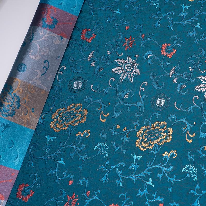 Tissu brocart floral bleu paon : mélange de rayonne, 75 cm de large