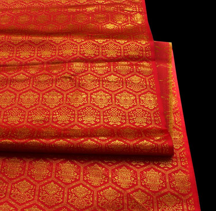 Tissu tissé or tibétain : jacquard rayonne porte-bonheur, 147 cm de large
