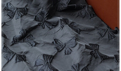Black Bow Jacquard Fabric: Yarn-Dyed Embossed Upholstery Material, 57" Wide