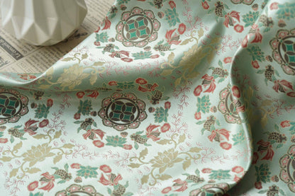 Tissu jacquard réversible bleu turquoise : motif poissons en relief, 165 cm de large