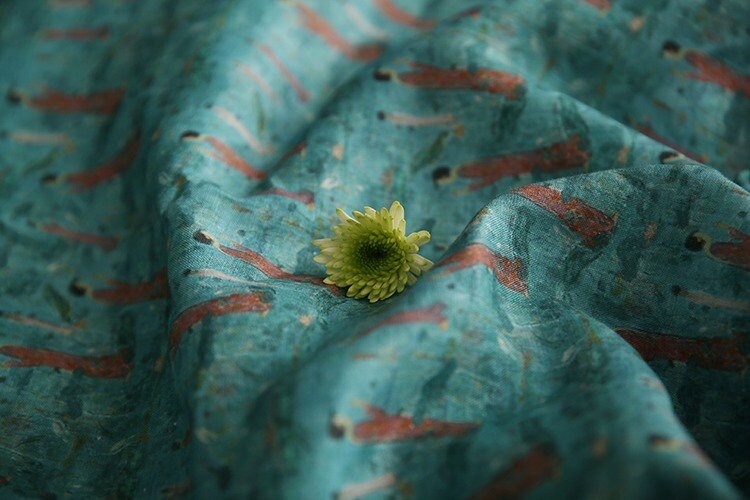 Tissu ramie imprimé Bouddha turquoise : 145 cm de large. Idéal pour l’ameublement, les costumes et la couture.