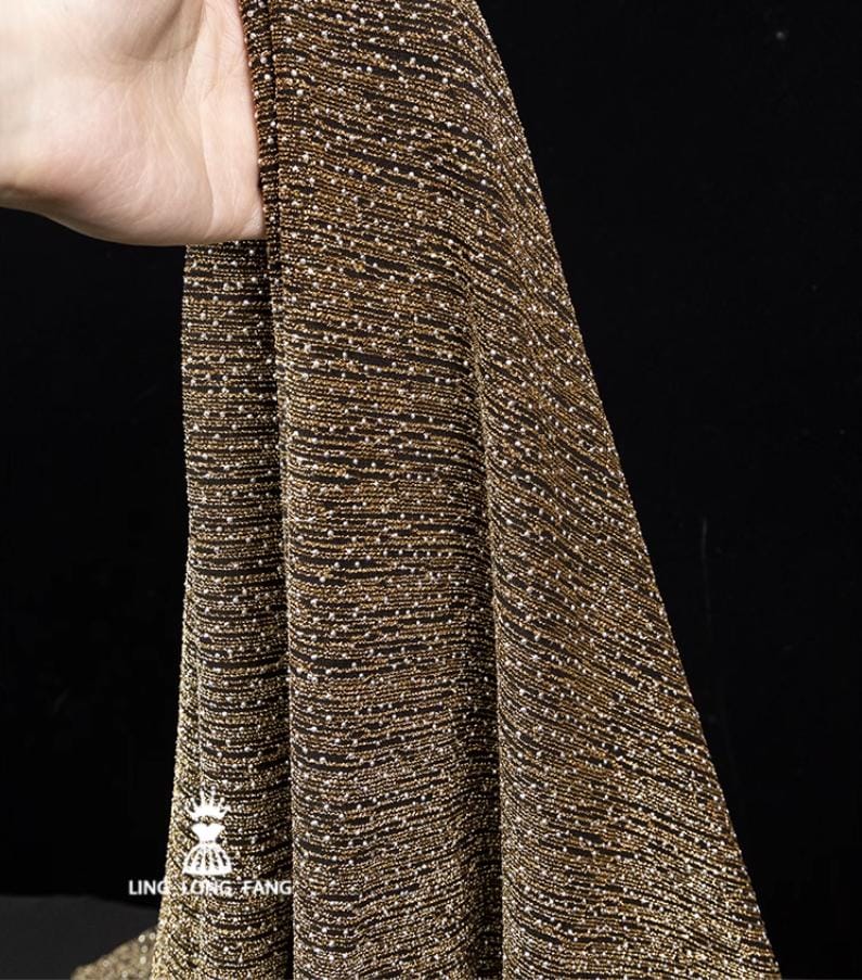 Tissu métallisé « Pluie de météores dorés » : mélange de polyester élastique, 160 cm de large