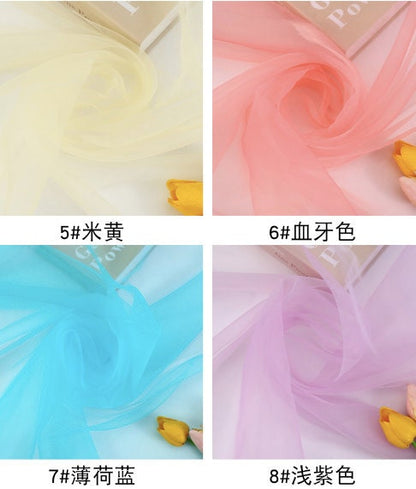 Tissu organza : tulle transparent de 150 cm de large pour robes, décorations et costumes.