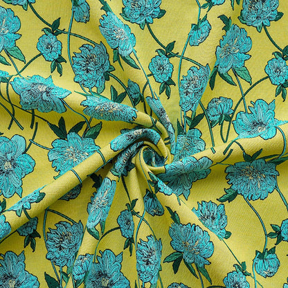 Tissu jacquard réversible : motif floral 3D bleu et jaune, largeur 135 cm