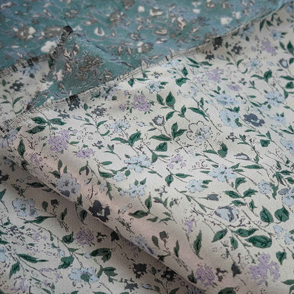 Tissu jacquard à motif floral : polyester texturé 3D, largeur 142 cm