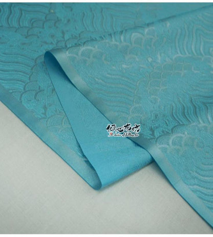 Tissu brocart à motif vagues turquoise : jacquard de soie et rayonne, 74 cm de large