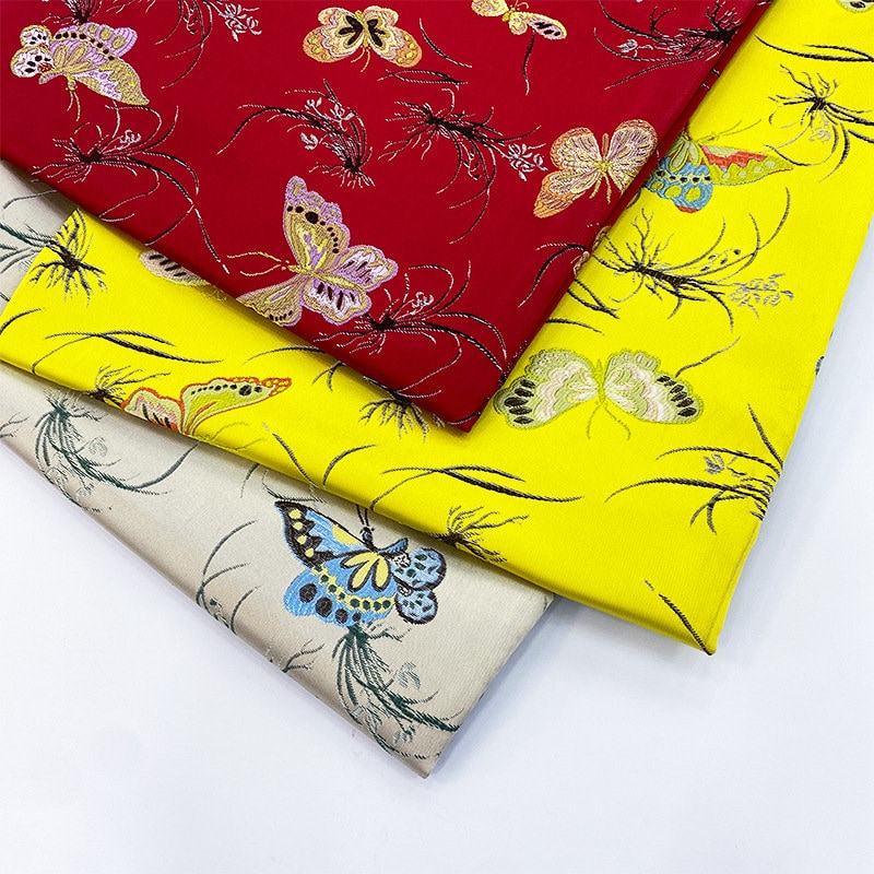Tissu jacquard papillon : 145 cm de large, en polyester