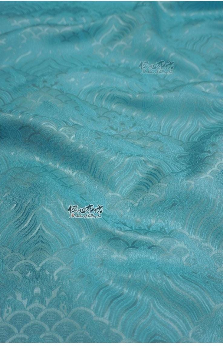 Tissu brocart à motif vagues turquoise : jacquard de soie et rayonne, 74 cm de large