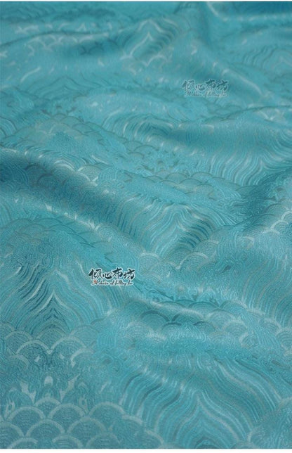 Tissu brocart à motif vagues turquoise : jacquard de soie et rayonne, 74 cm de large