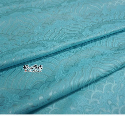 Tissu brocart à motif vagues turquoise : jacquard de soie et rayonne, 74 cm de large