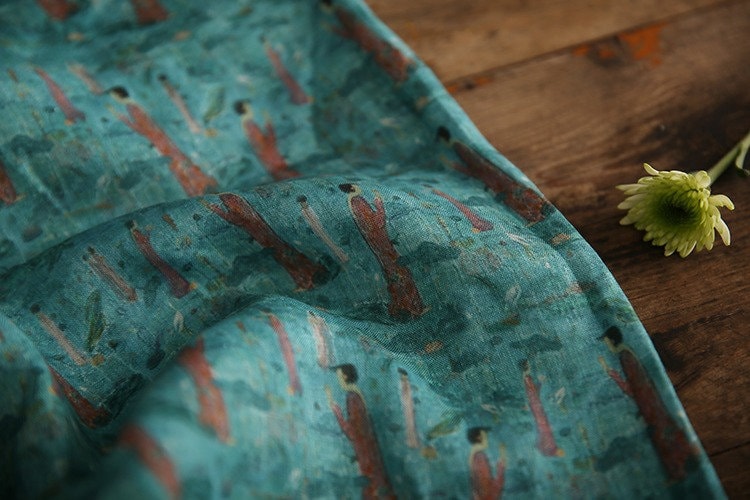 Tissu ramie imprimé Bouddha turquoise : 145 cm de large. Idéal pour l’ameublement, les costumes et la couture.