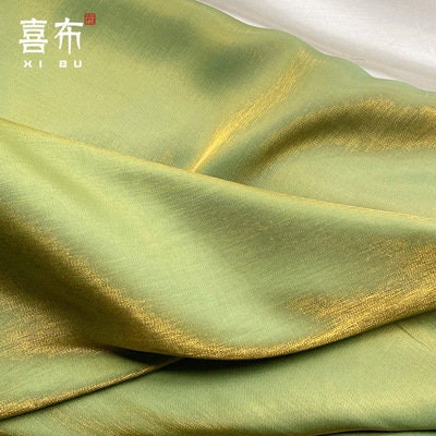 Tissu soyeux brillant et glacé : effet dégradé scintillant, largeur 147 cm, vendu au mètre