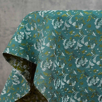 Tissu jacquard floral turquoise : matériau tissé couleur pour la couture et l'ameublement