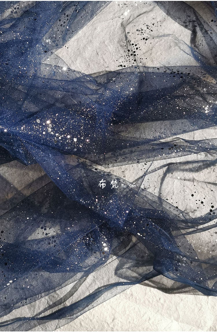 Tissu organza Space Galaxy : paillettes bronzées, 150 cm de large