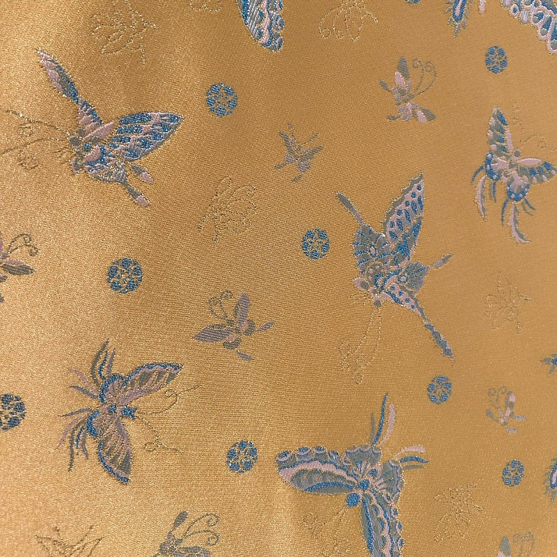 Tissu brocart papillon orange : jacquard imitation soie, 150 cm de large