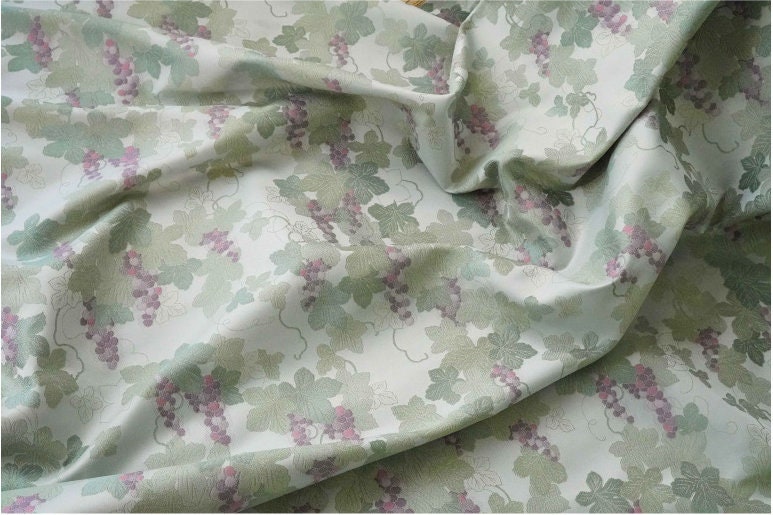 Tissu jacquard raisin : polyester gaufré doré et bronzé