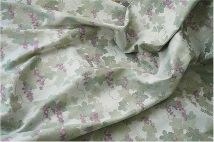 Tissu jacquard raisin : polyester gaufré doré et bronzé