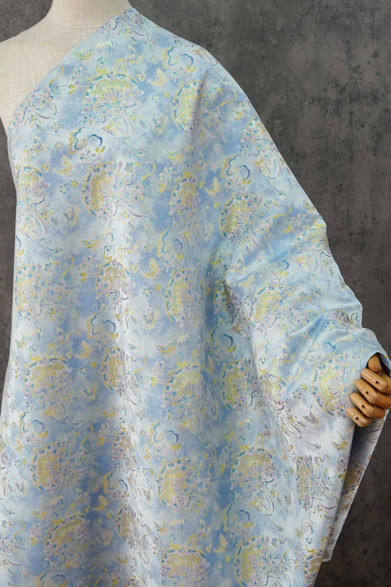 Light Blue Magnolia Butterfly Song Brocade Fabric, Gold Thread Jacquard with Fan Motif for Qipao, Hanfu, Dresses, Bags and Sewing
